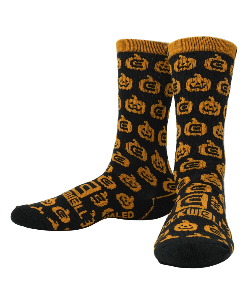 Rockwell halloween socks. orange pumpkins on black sock